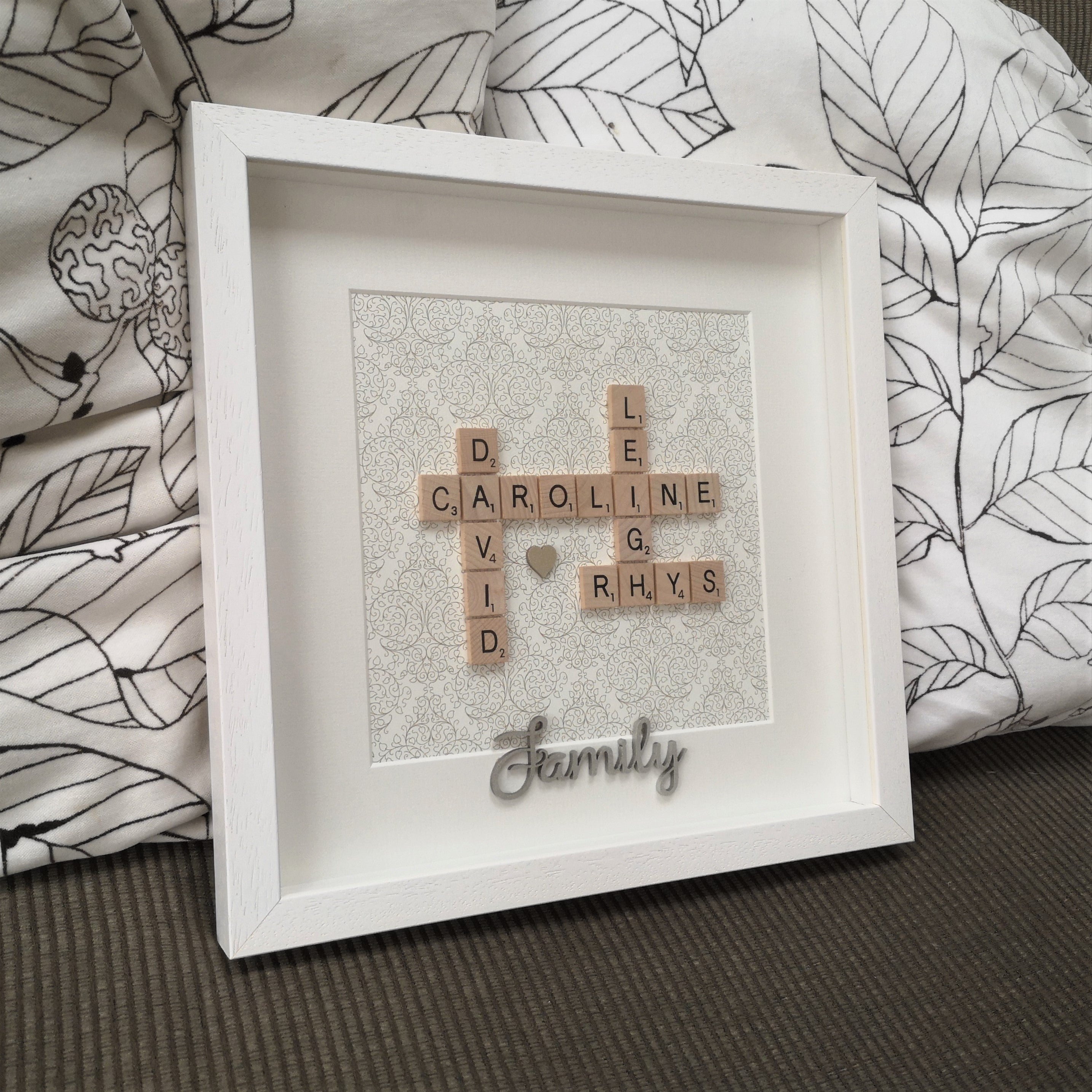 Family Names in wooden scrabble tiles on gold delicate damask background with a handpainted wooden FAMILY embellishment  in a handmade white 30x30cm deep box wooden frame