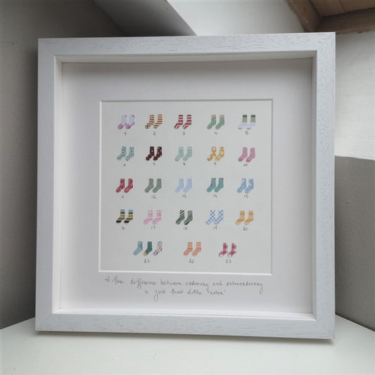 47 papercut socks in a handmade 30x30cm deep box wooden frame, celebrating the 47 chromosomes that people with Down Syndrome have.