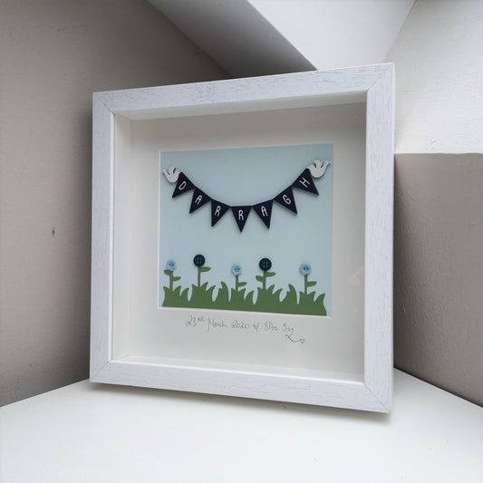 Hand-painted wooden bunting and doves, over papercut flowers embellished with buttons, in a handmade 25x25cm deep box wooden frame.