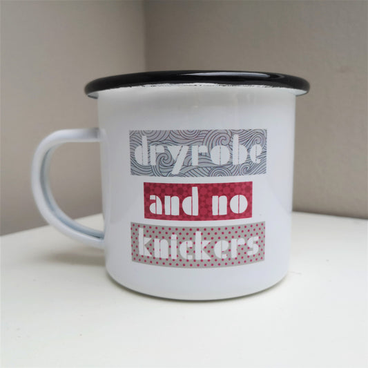 A white steel enamel mug with DRYROBE AND NO KNICKERS on the front with blocks of greys and dark pinks around the letters