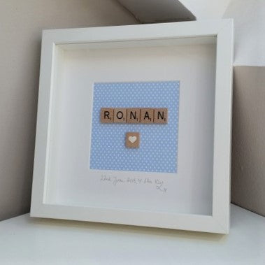 Personalised baby blue Scrabble name frame, polkadot blue backing, wooden deep box frame.